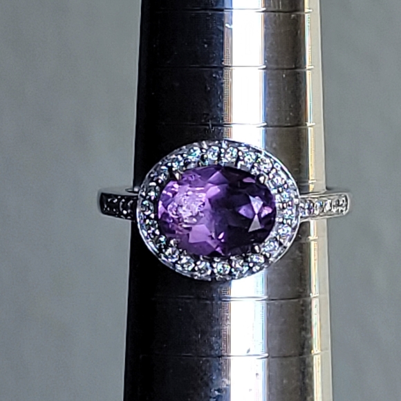 14K WHITE GOLD RING WITH BEAUTIFUL AMETHYST AND NATURAL DIMONDS ALL AROUND.